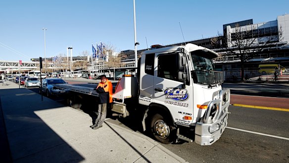 A tow truck driver waits at the airport in case of a taxi blockade.