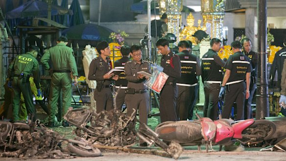 Police investigate the scene at the Erawan Shrine after an explosion in Bangkok, Thailand, on August 17.