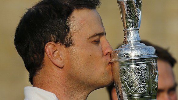 American Zach Johnson he kisses the Claret Jug after winning the British Open.