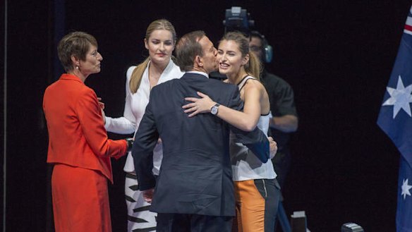 Daggy dad: Opposition Leader Tony Abbott with his daughters Frances and Bridget and wife Margie at the Coalition's campaign launch.
