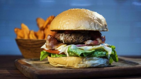 Beef and bacon burger with sweet potato fries.