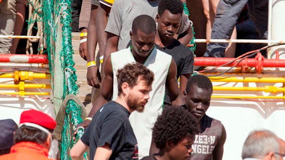 Migrants disembark at the Reggio Calabria harbour, Southern Italy, on Saturday.