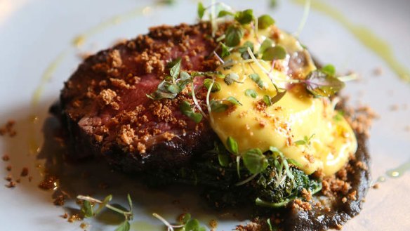 South American-style steak bearnaise: Grilled rump cap, burnt onion, yerba mate bearnaise, farofa and kale.