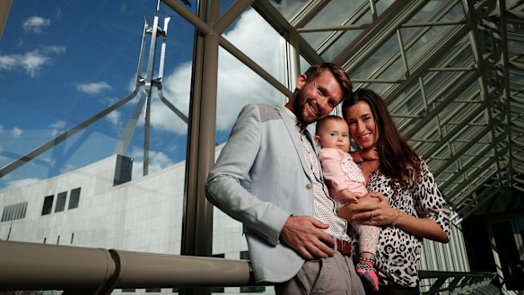 Jonathan McElwee and Bethan McElwee with their one-year-old daughter Aviana, who visited Parliament House in Canberra for a Spinal Muscular Atrophy Australia event on August 16, 2017.
