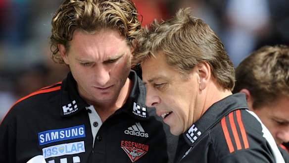James Hird and Bomber Thompson working together in 2011. 
