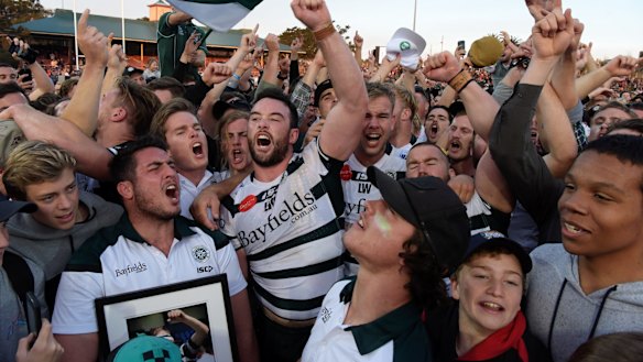 Alive and well: Warringah players and fans celebrate their Shute Shield success.