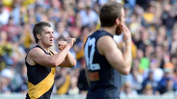 Crossing swords: Dustin Martin caused controversy for this so-called 'prison sign' celebration earlier this month.