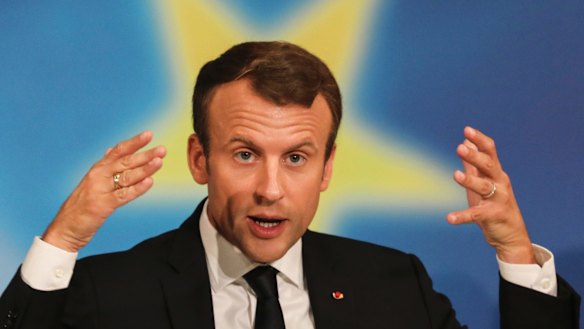 French President Emmanuel Macron gestures as he delivers a speech on the European Union at the amphitheater of the Sorbonne university in Paris.