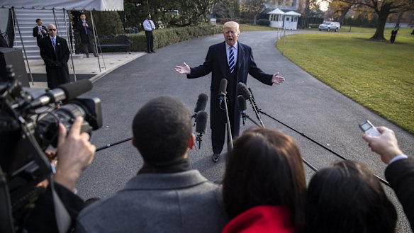 Donald Trump speaks to members of the media before leaving DC for New York.