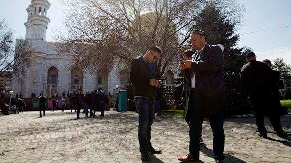 Omir Bekali, front right, now free, prepares to pray at a mosque in Almaty, Kazakhstan. 