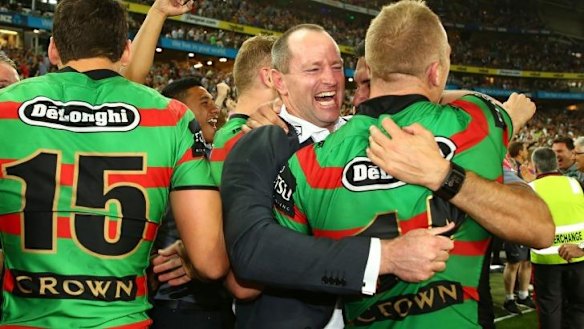 The drought is broken: Souths coach Michael Maguire celebrates the win with Jason Clark.