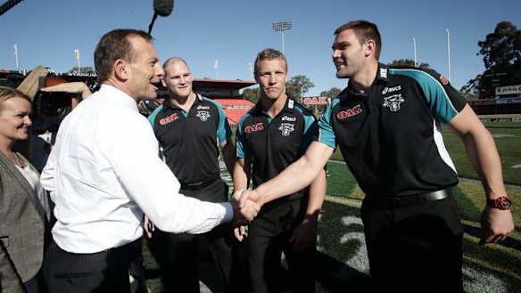 Opposition leader Tony Abbott meets with Penrith Panthers players, in Penrith, NSW, on Tuesday.