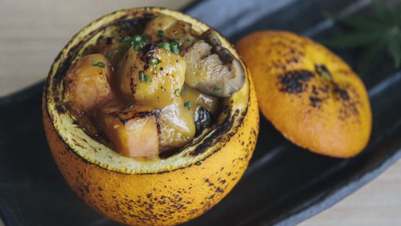 Roast umami vegetables with orange miso in an orange pot.