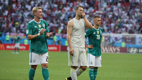 Shock loss: Germany's Julian Brandt, left, goalkeeper Manuel Neuer, and Joshua Kimmich. 