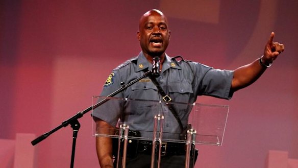 Missouri Highway Patrol Captain Ron Johnson speaks during a service for the family of Michael Brown on Sunday
