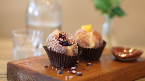 Orange blossom and blueberry (left) and mandarin marmalade and chocolate custard doughnuts at Cobb Lane.