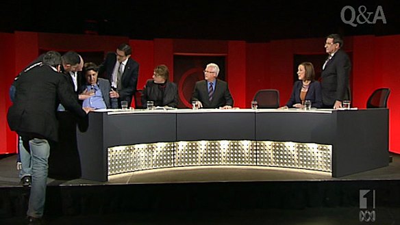 "Sorry I couldn't stay" ... Greg Combet and members of the crew go to the GetUp! director's aid before he is taken to hospital.