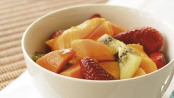 Chilled mangoes with berries and lemon rosewater syrup