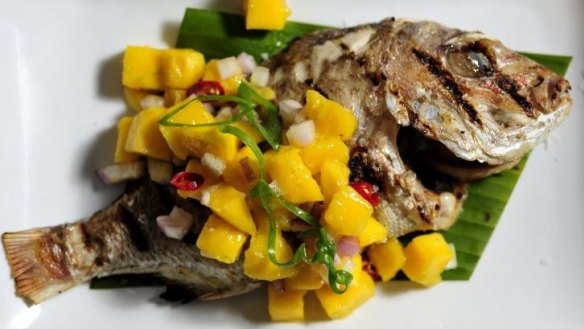Whole baby snapper with mango salsa.