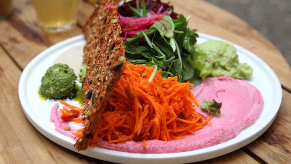 Perfect Circle Salad with a colourful swipe of beetroot dip.