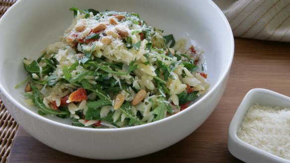 Orzo (risoni) pasta with rocket and pine nuts.