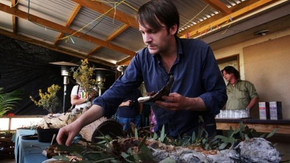 Rene Redzepi samples kangaroo meat during a visit to the Iga Warta Indigenous community in the South Australian outback.