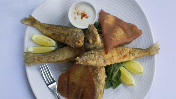 A plate of whole fried whiting.