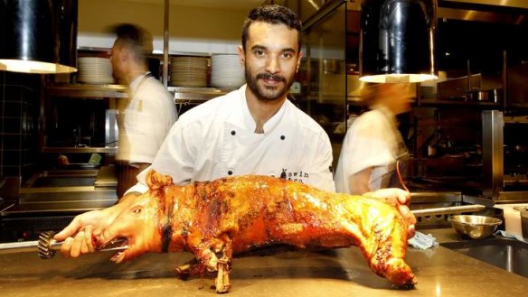 Head chef Robert Taylor with a suckling pig.