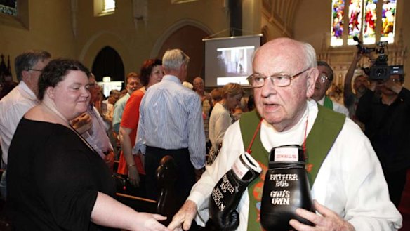 Father Bob Maguire bids his final farewell to a capacity congregation at Saints Peter and Paul Church in South Melbourne yesterday.