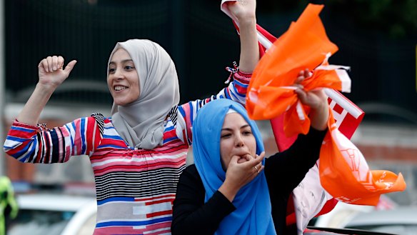 Erdogan supporters celebrate outside his official residence in Istanbul on Sunday.