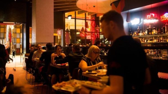 Neon beer signs light the dining room at San Antone by Bludso's.