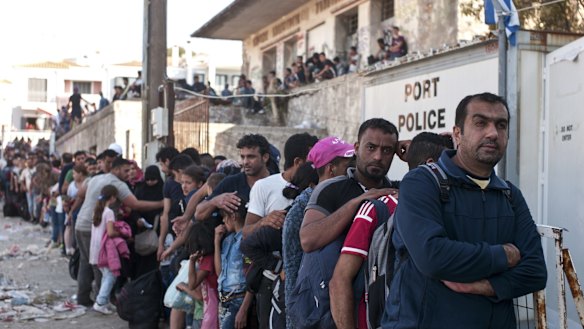 Refugees line up as they wait to register on the north-eastern Greek island of Lesbos.