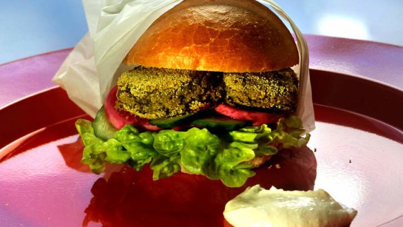 Falafel burger with a dollop of lemony tahini-yoghurt sauce.