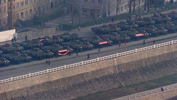 Trucks line up on a Pyongyang street prior to celebrations in memory of North Korea's first leader Kim Il-sung.