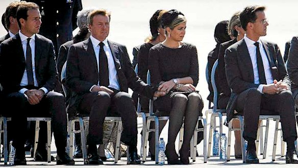 King Willem-Alexander and Queen Maxima (centre) mark the return of MH17 victims at Eindhoven.