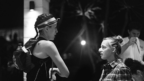 Samantha Gash, right, talks to ultra runner Vanessa Niemeyer at the half way mark.