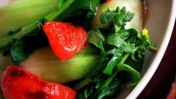 Tender greens with whole cumin, tomatoes and coriander