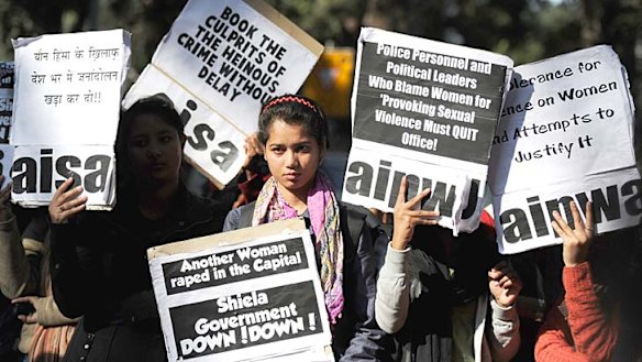 Indian activists listen a speech outside Delhi's chief minister residence during a protest in New Delhi, following the gang-rape of a student.