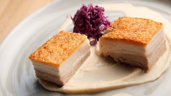 Crispy pork belly, white bean puree and red cabbage served at Stray Neighbour.