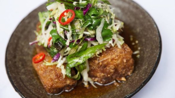 Red Spice Road's signature pork belly, with apple slaw, chilli caramel and black vinegar.
