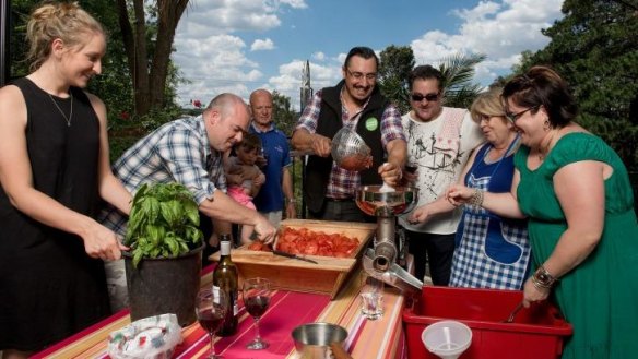 Loredana Grossi, Daniel Airo-Farulla, Lino Airo-Farulla, Rachele Saflekas, Frank Bovezza, Guy Grossi, Angelina Airo-Farulla and Adrienne Marson making tomato sauce.