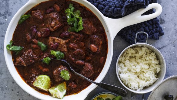 Chilli con carne served with Mexican crema and rice.