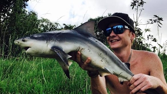Jamie Leeder with a bull shark caught earlier this year, one of the many he and Jarrad Smith have caught.