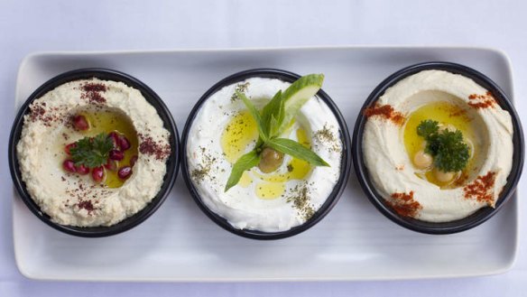 The trio of dips includes baba ghanoush, labneh and hummus.