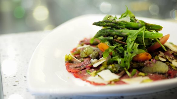 Carpaccio di manzo: Balsamic glazed beef carpaccio, drizzled with olive oil and lemon juice, with rocket and parmesan. 