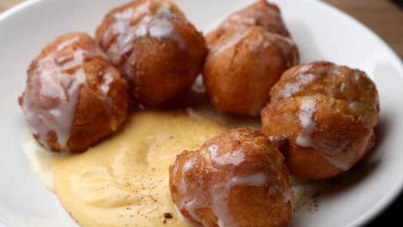 The beignets with passionfruit cream and condensed milk.