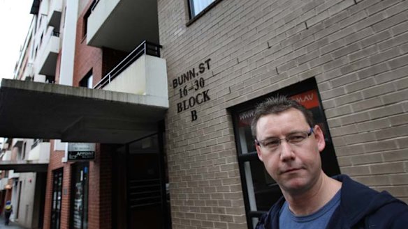 Disheartened … Mark Terry in front of his flat.