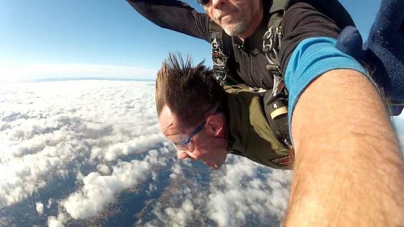 Put a cork in it ... Mount Majura's Frank van de Loo in free-fall with Curtis Morton of Canberra Skydive.