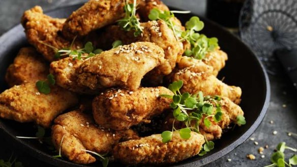 Sticky fried chicken wings with honey and sesame glaze.