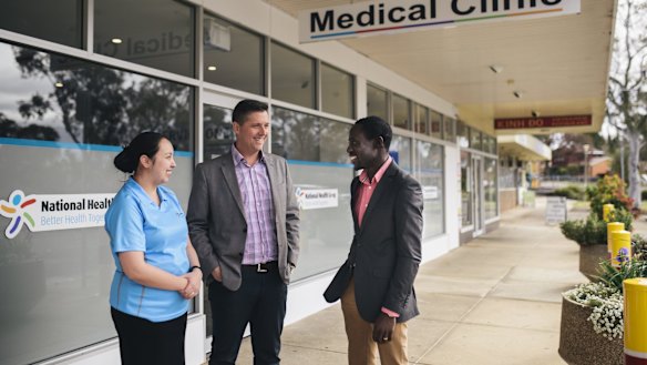 Nurse Kieth Ancheta, director Adrian Watts and medical director Joe Oguns outside the National Health Co-op medcial clinic in Macquarie. 
